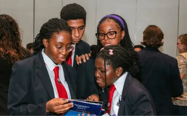 Students engaging with university delegates