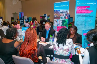 Students networking with university representatives at Africa Study Abroad Fair